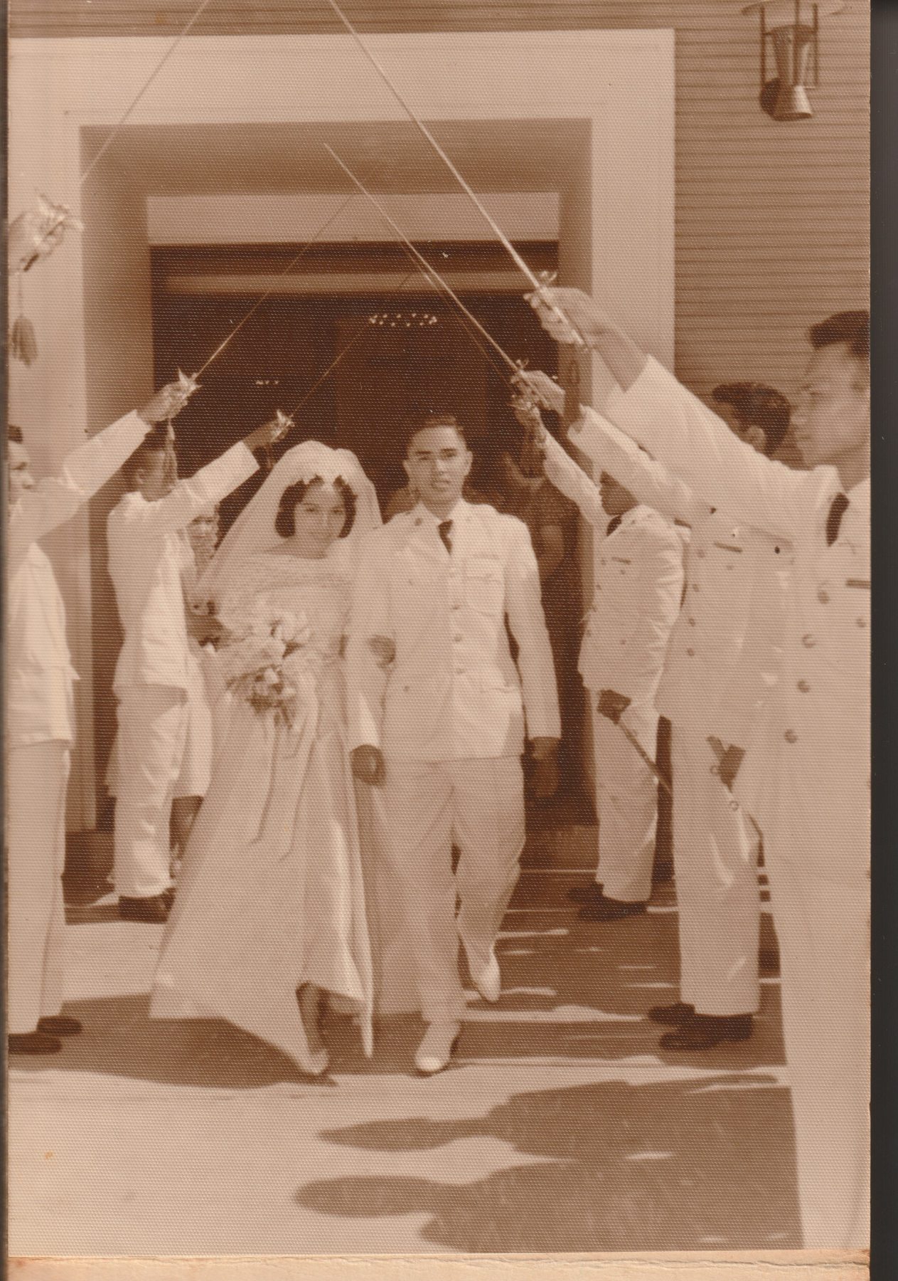 Connie and Carlos Mariano cutting their wedding cake